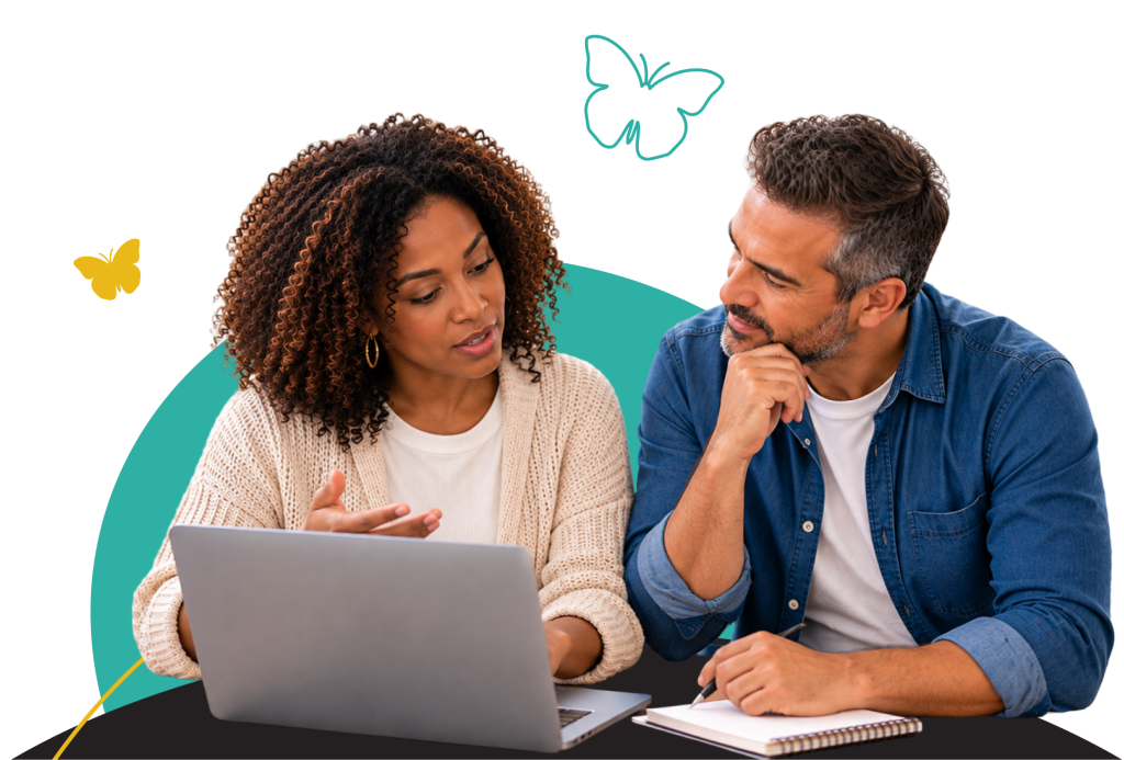 Two adults discussing volunteer opportunities at a laptop.