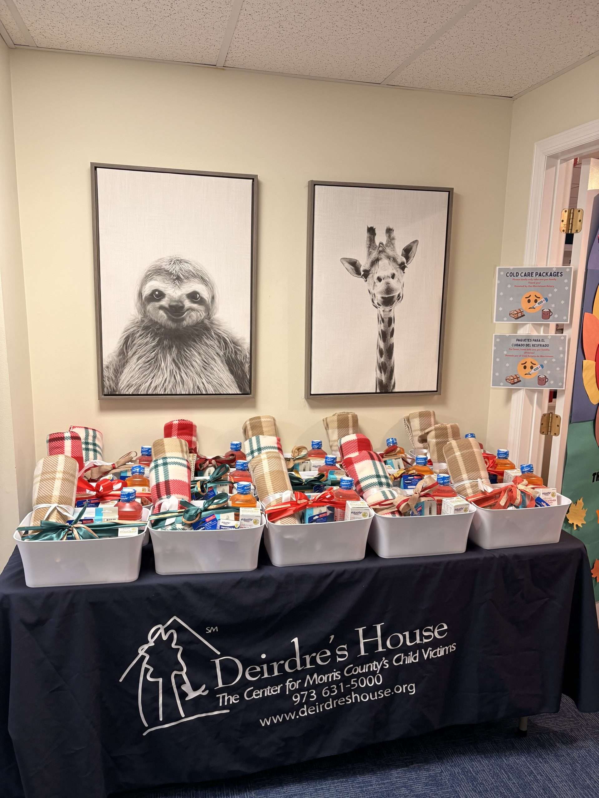 Donated supplies and gift baskets arranged on a table at Deirdre’s House.