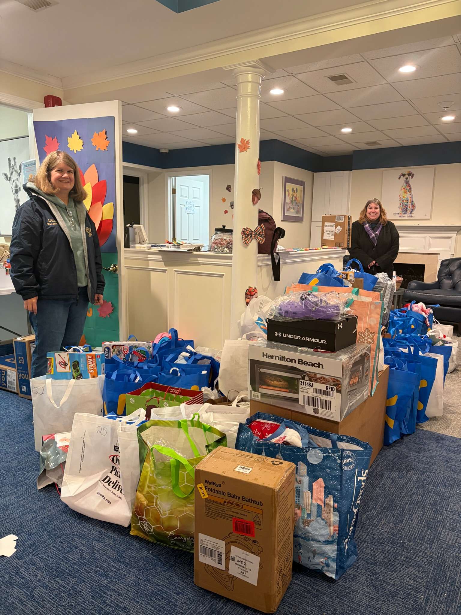 Volunteers organizing donated supplies and care packages inside Deirdre’s House.