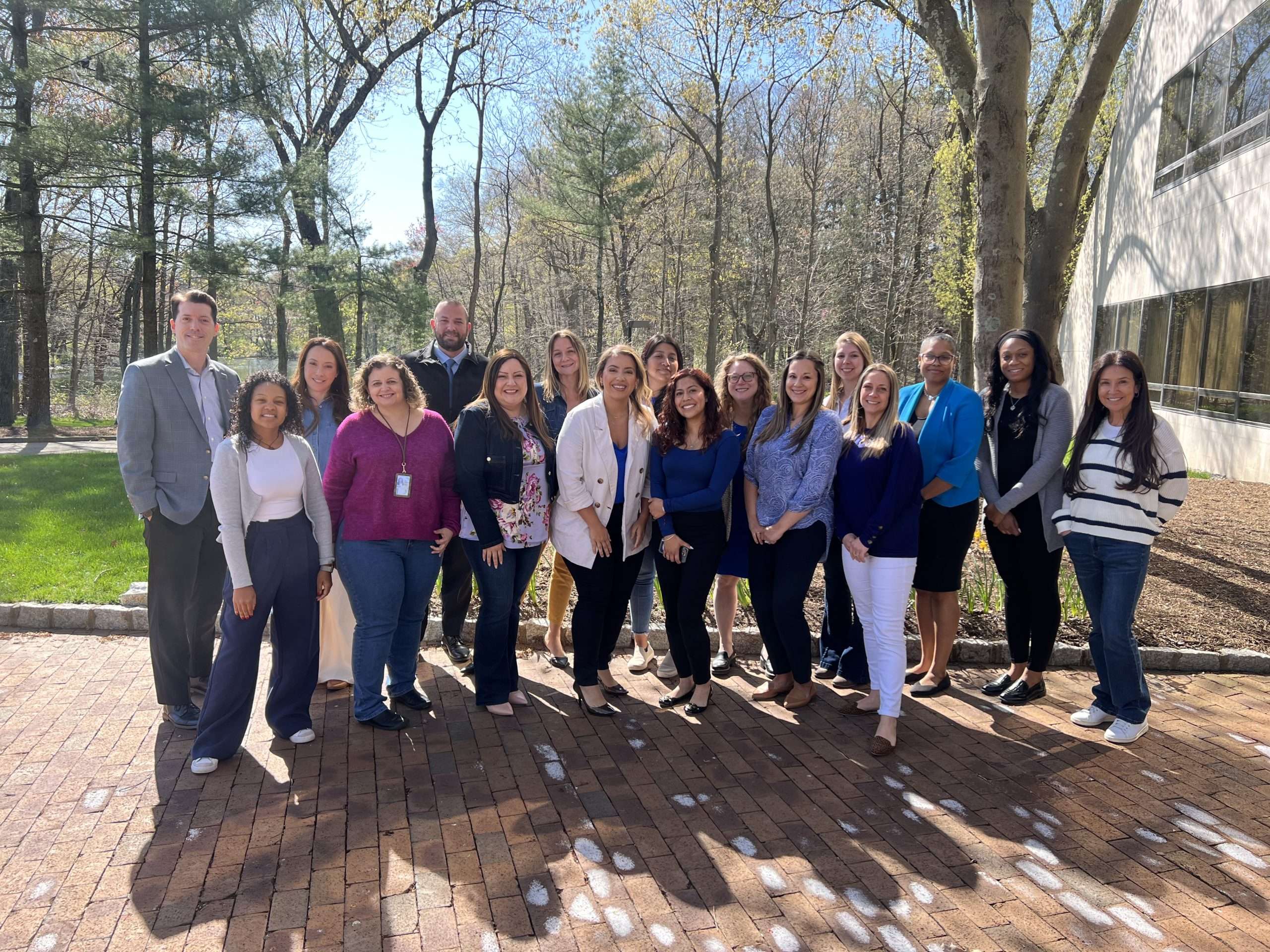 Members of the multidisciplinary team standing together outdoors